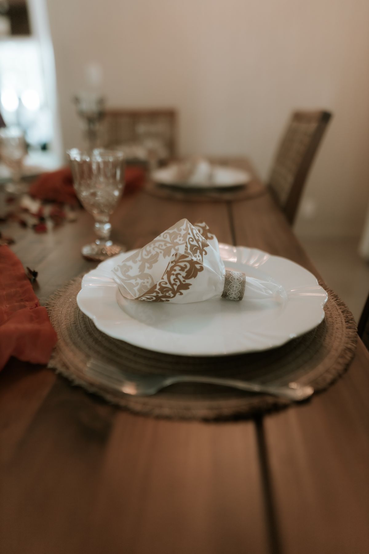 Elegant table setting with a decorative napkin and fine glassware for a formal dining experience.